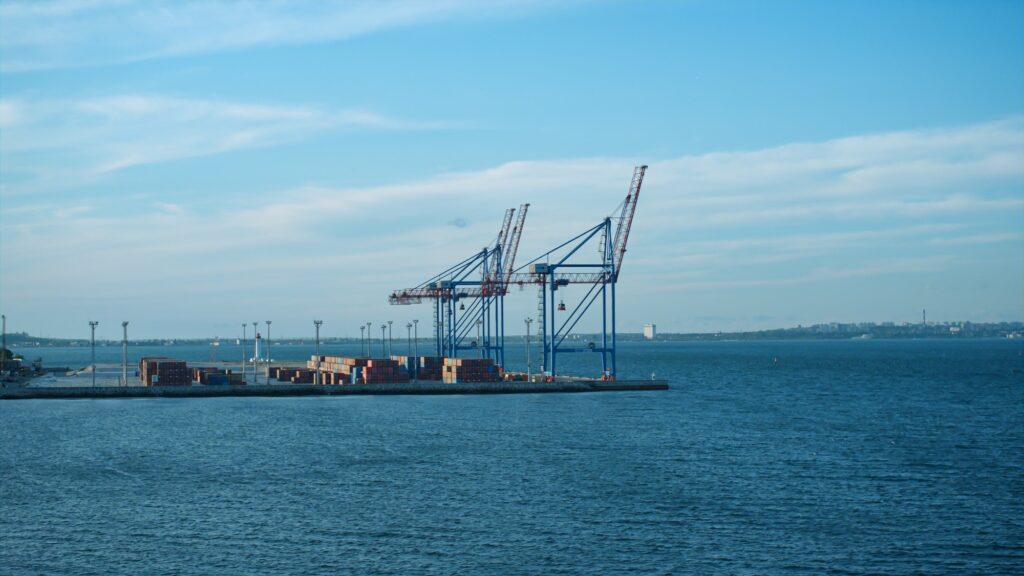 Cargo sea port landscape on sunny day. Modern global delivery shipping industry