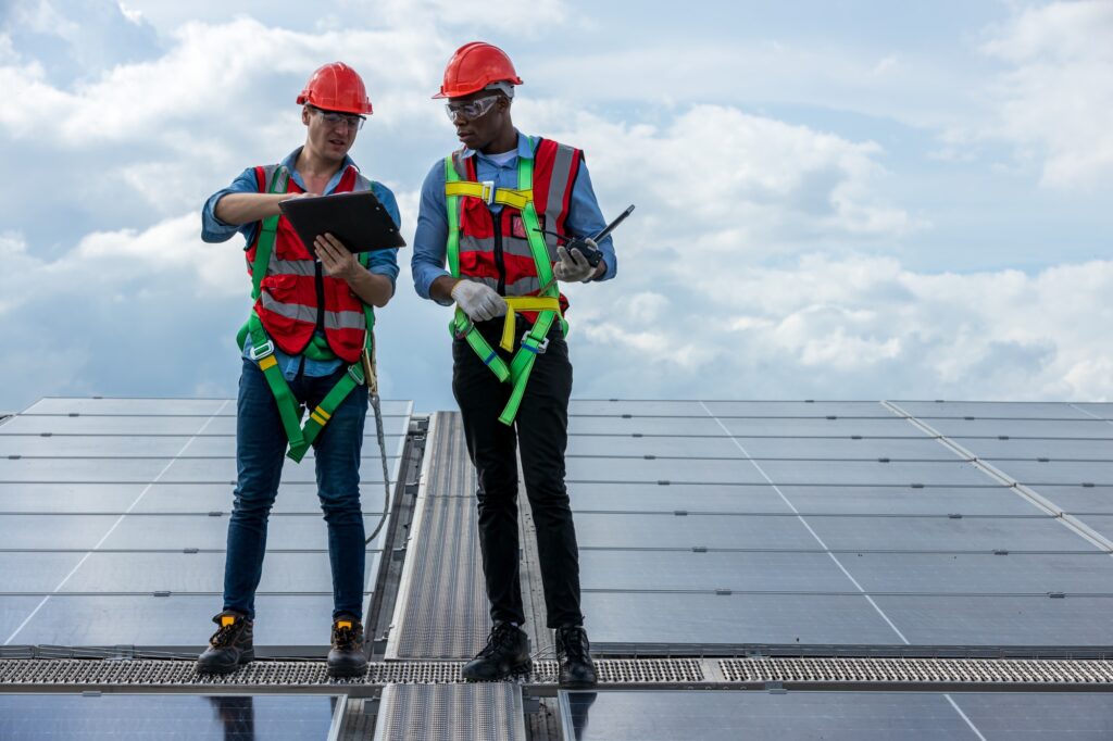 Engineer working setup Solar panel at the roof top. Engineer or worker work on solar panels or solar